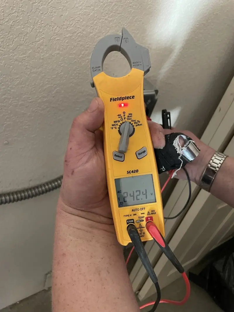Voltage testing with clamp meter during Whole House Surge Protector in Gloucester